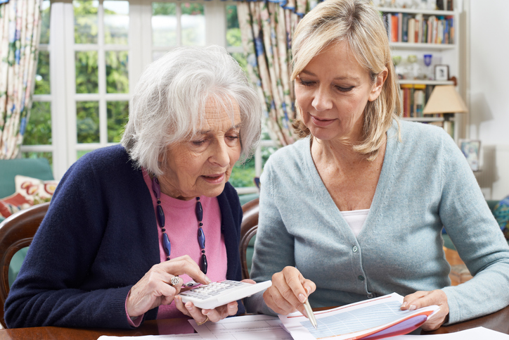 A lady and her daughter trying to figure questions to ask when visiting assisted living facility