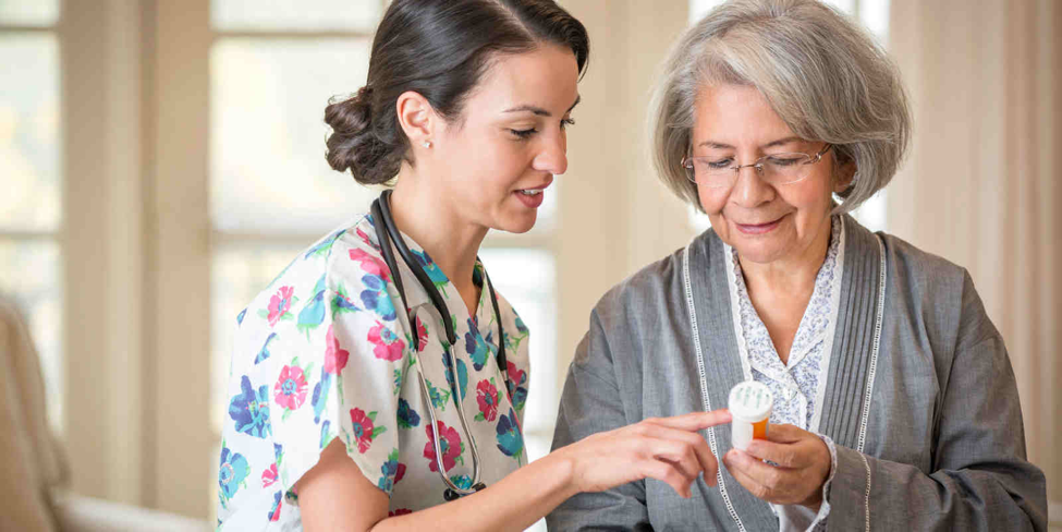 A nurse answering an elderly lady's question about how effective is Senna for constipation