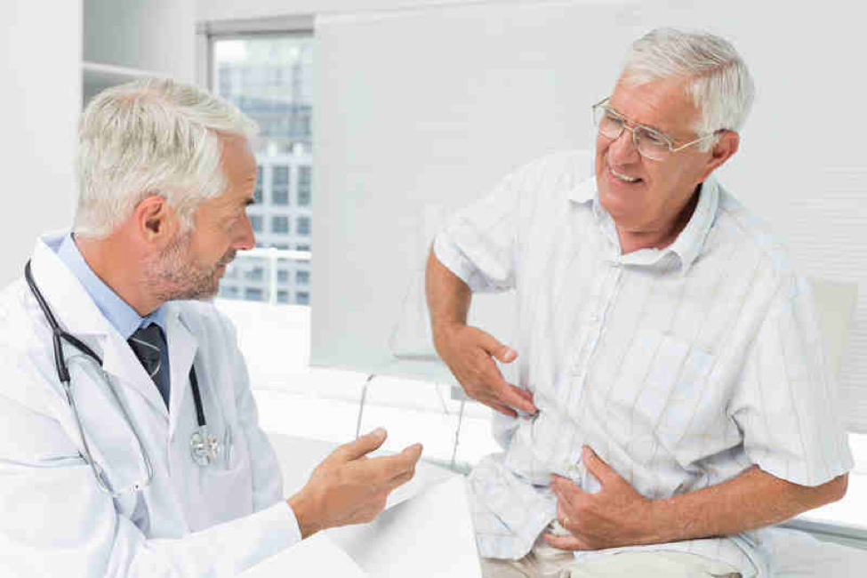 A doctor talking to a male patient about using Senna for constipation