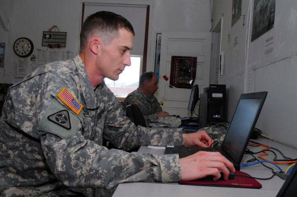 A service member looking at a computer and learning about tricare reserve select coverage